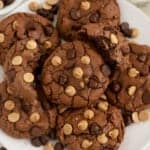 Peanut butter brownie cookies on a white plate.