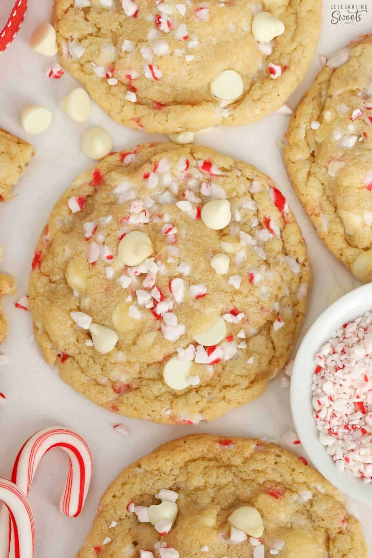 White chocolate peppermint cookies next to candy canes.