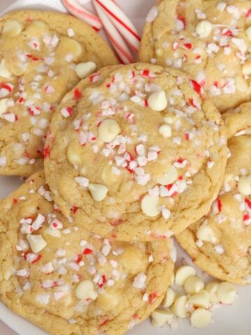 White plate topped with white chocolate peppermint cookies.