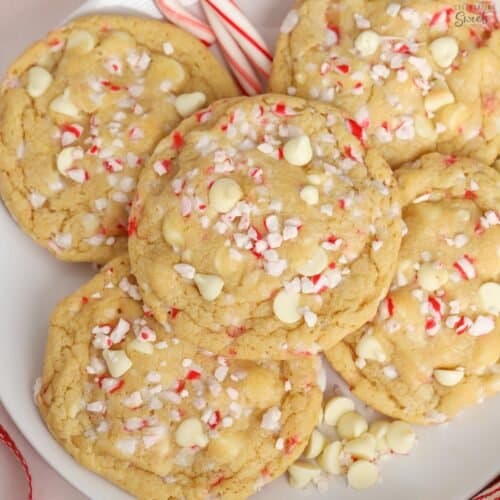 White plate topped with white chocolate peppermint cookies.