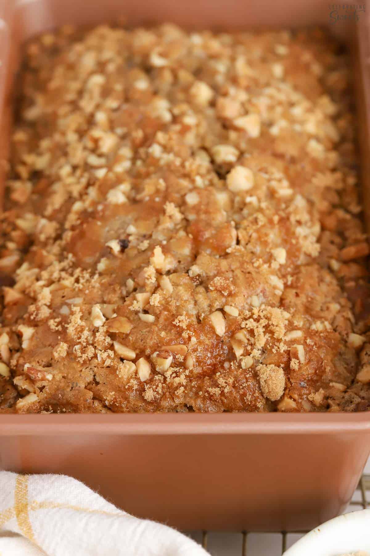 Closeup of banana nut bread in a loaf pan.