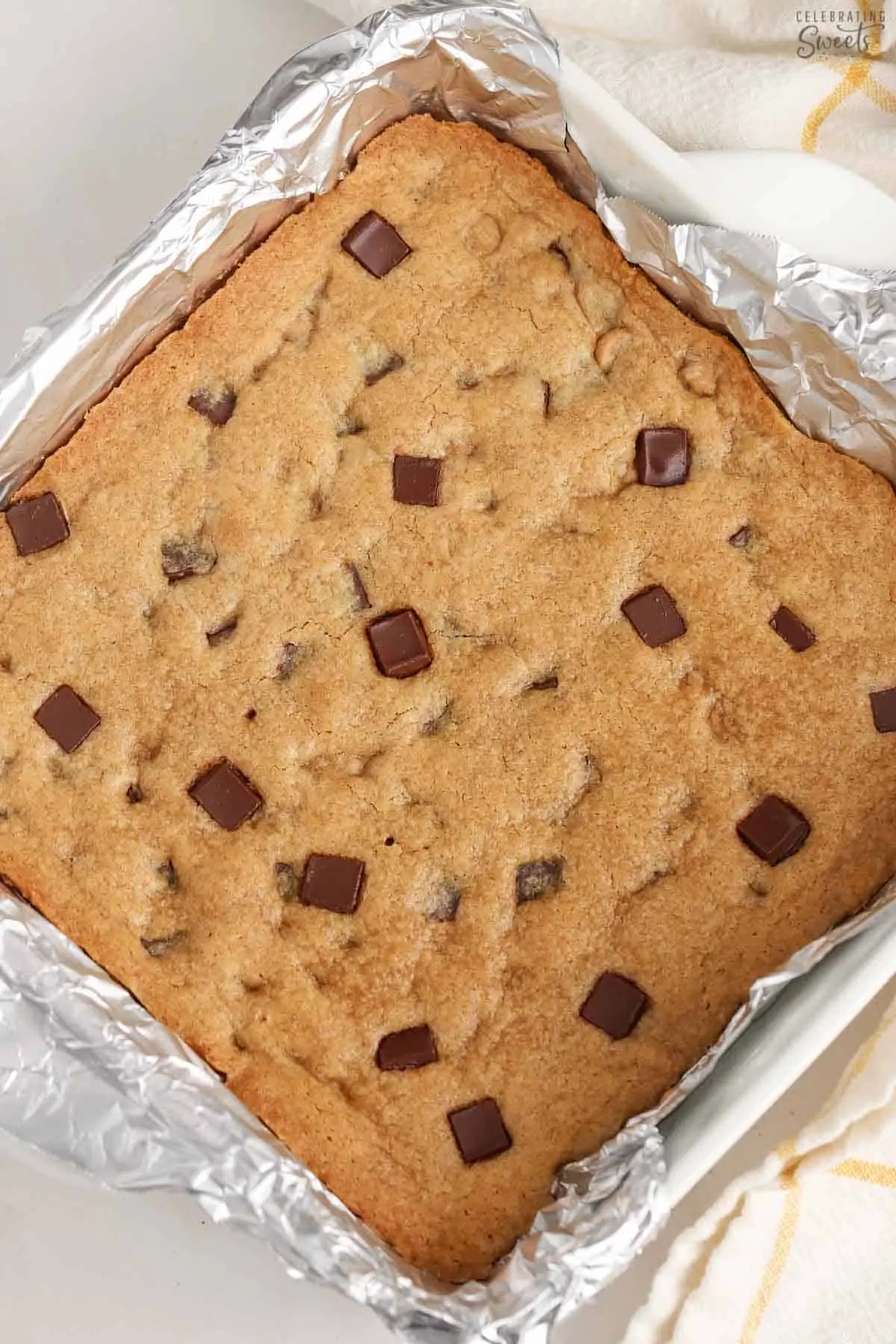 Blondies in a foil-lined pan.