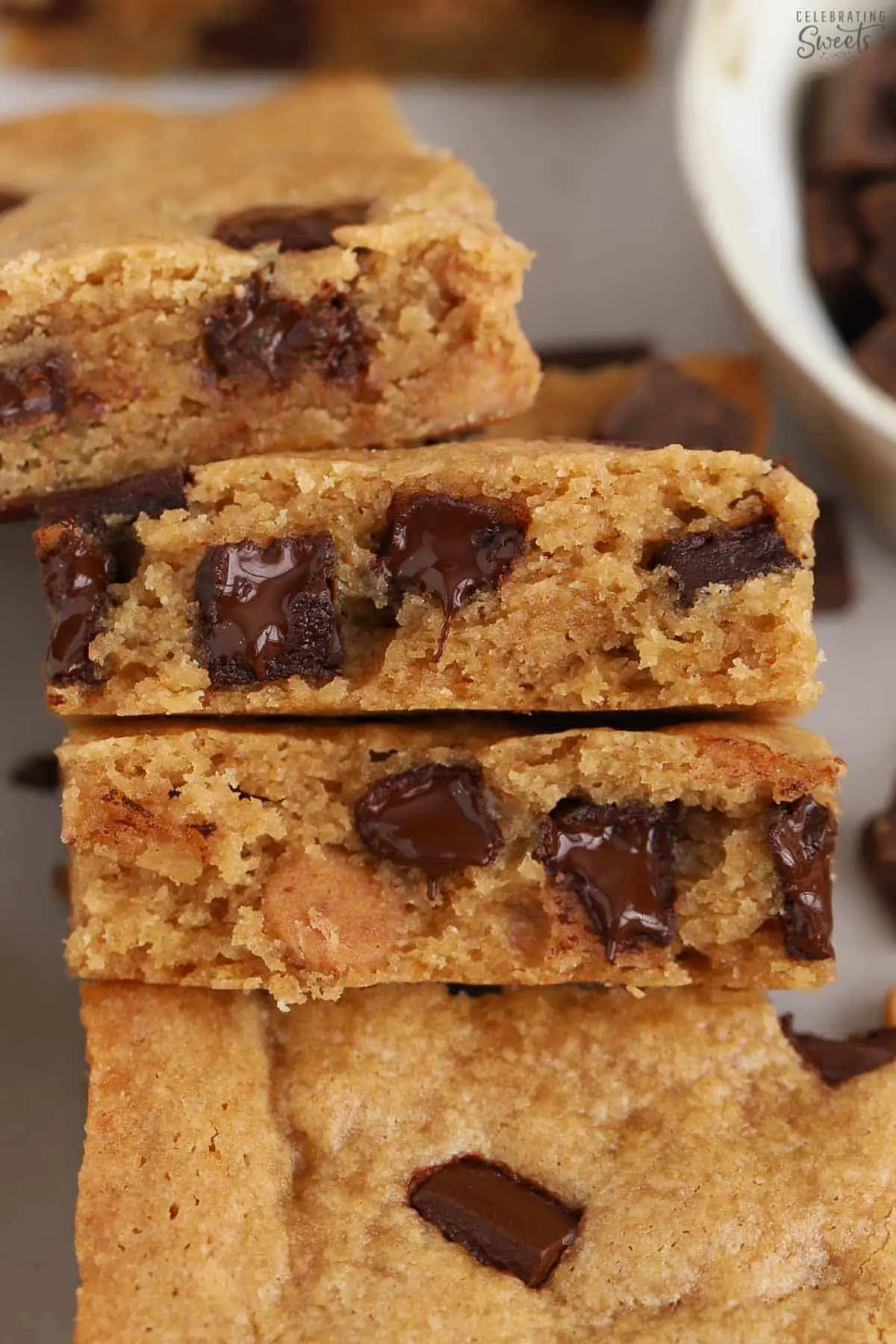 Closeup of blonde brownies filled with chocolate chips.