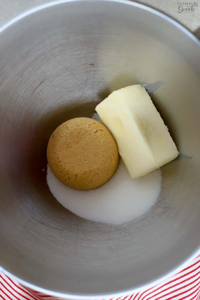 Butter and sugars in a mixing bowl.