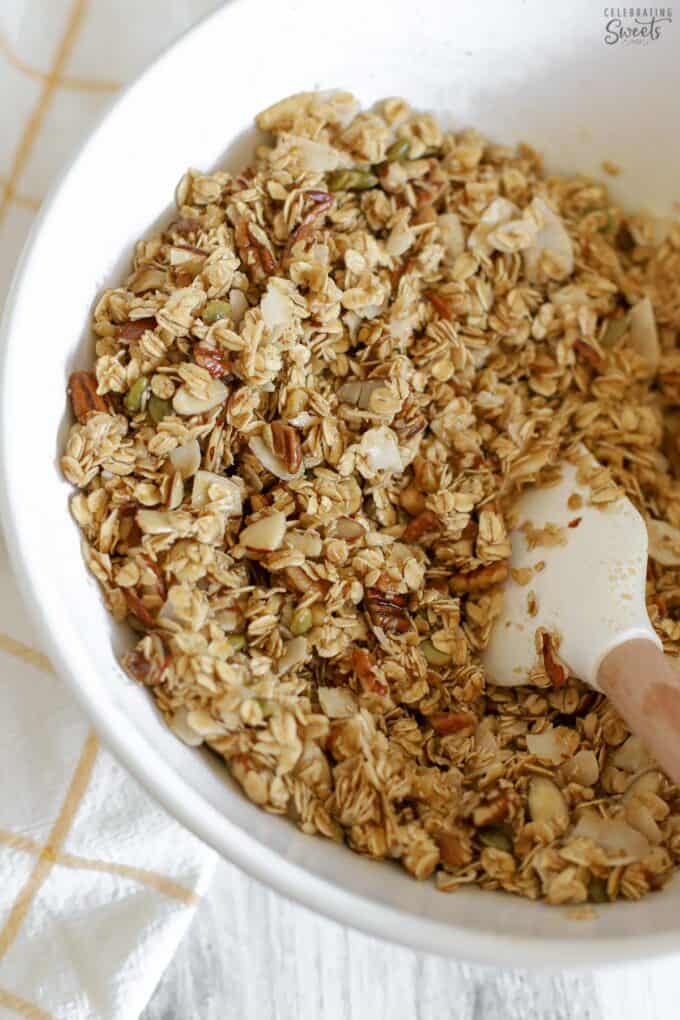 Granola in a large white bowl.