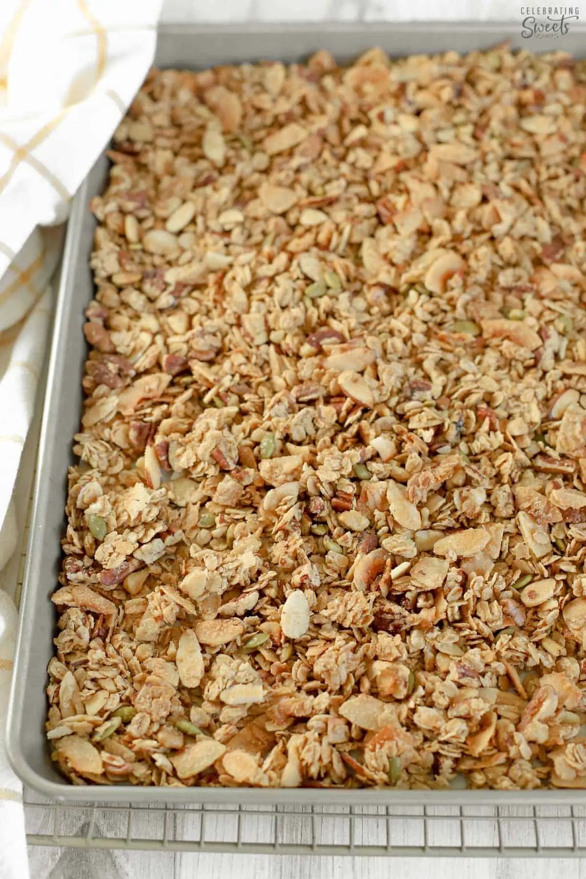 Baking sheet of granola on a wire rack.