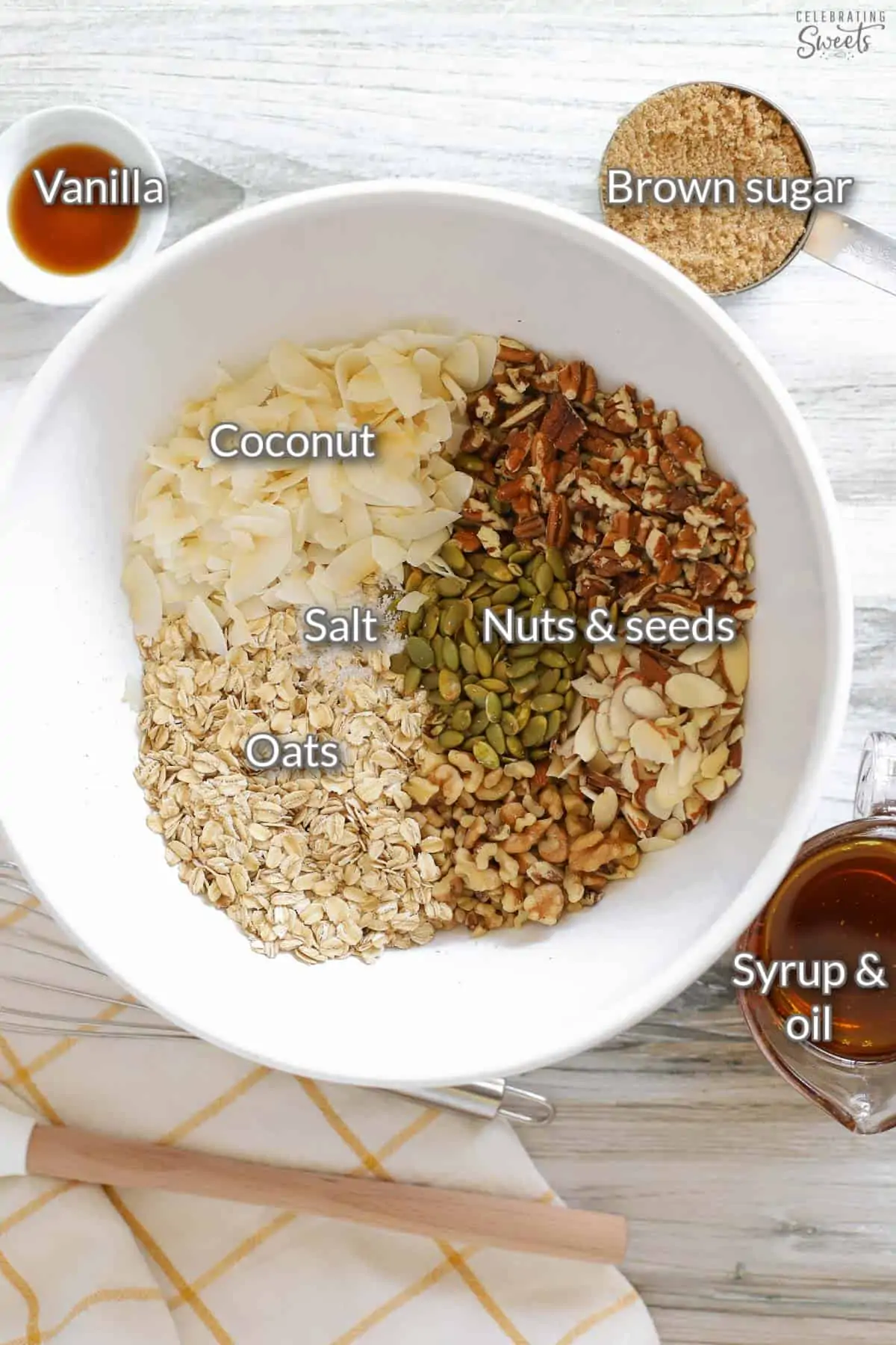 Ingredients for homemade granola: oats, nuts, sugar, oil, vanilla.