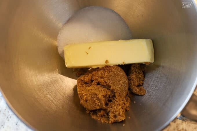 Butter, brown sugar, and white sugar in a mixing bowl.