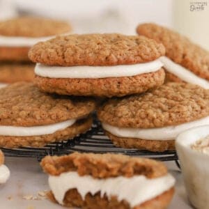 Stack of oatmeal cream pies on a wire rack.