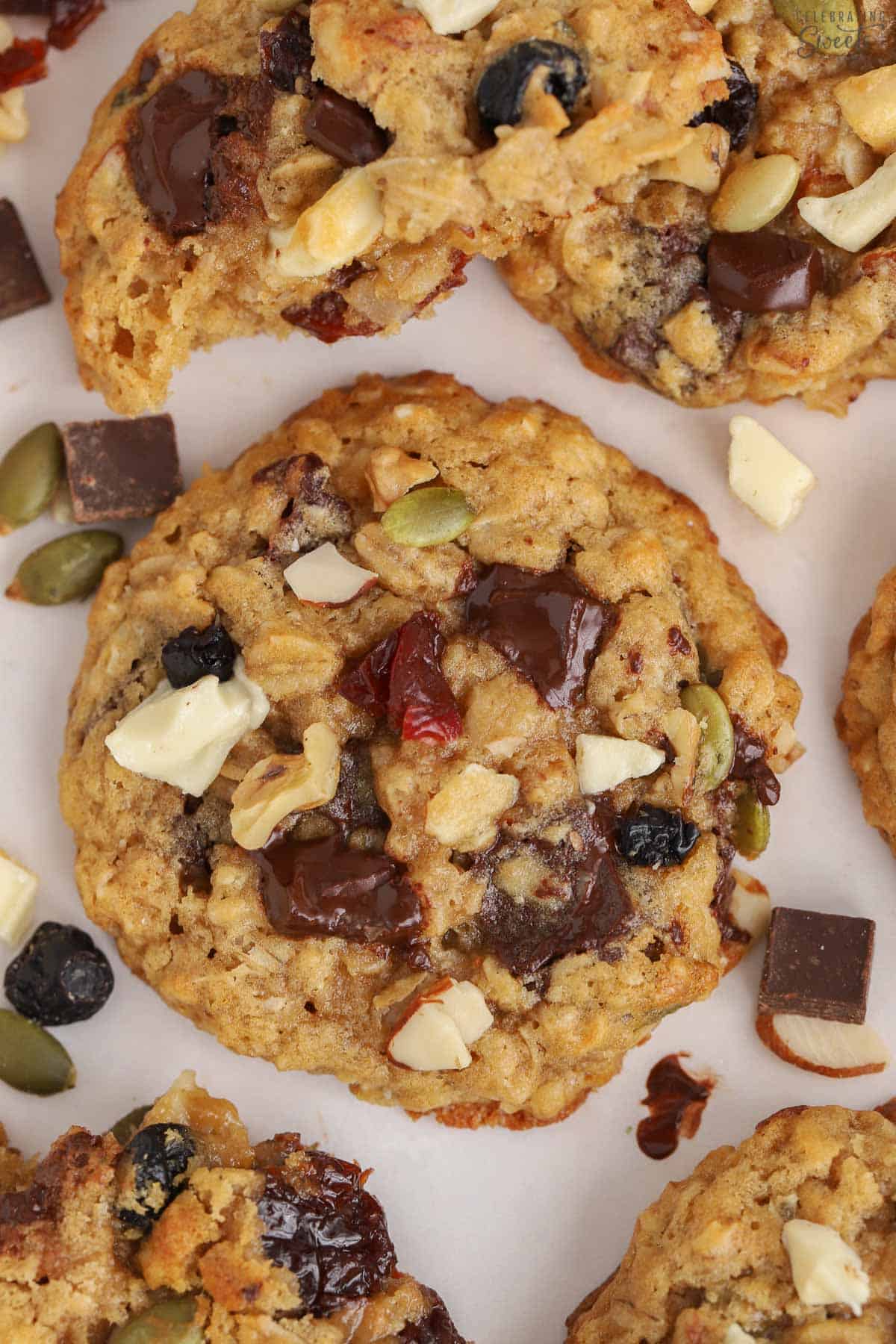 Trail mix cookies on a white board.