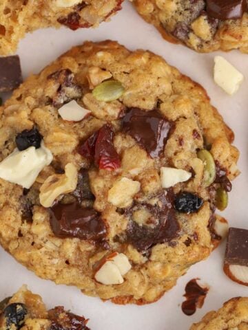 Trail mix cookies on a white board.