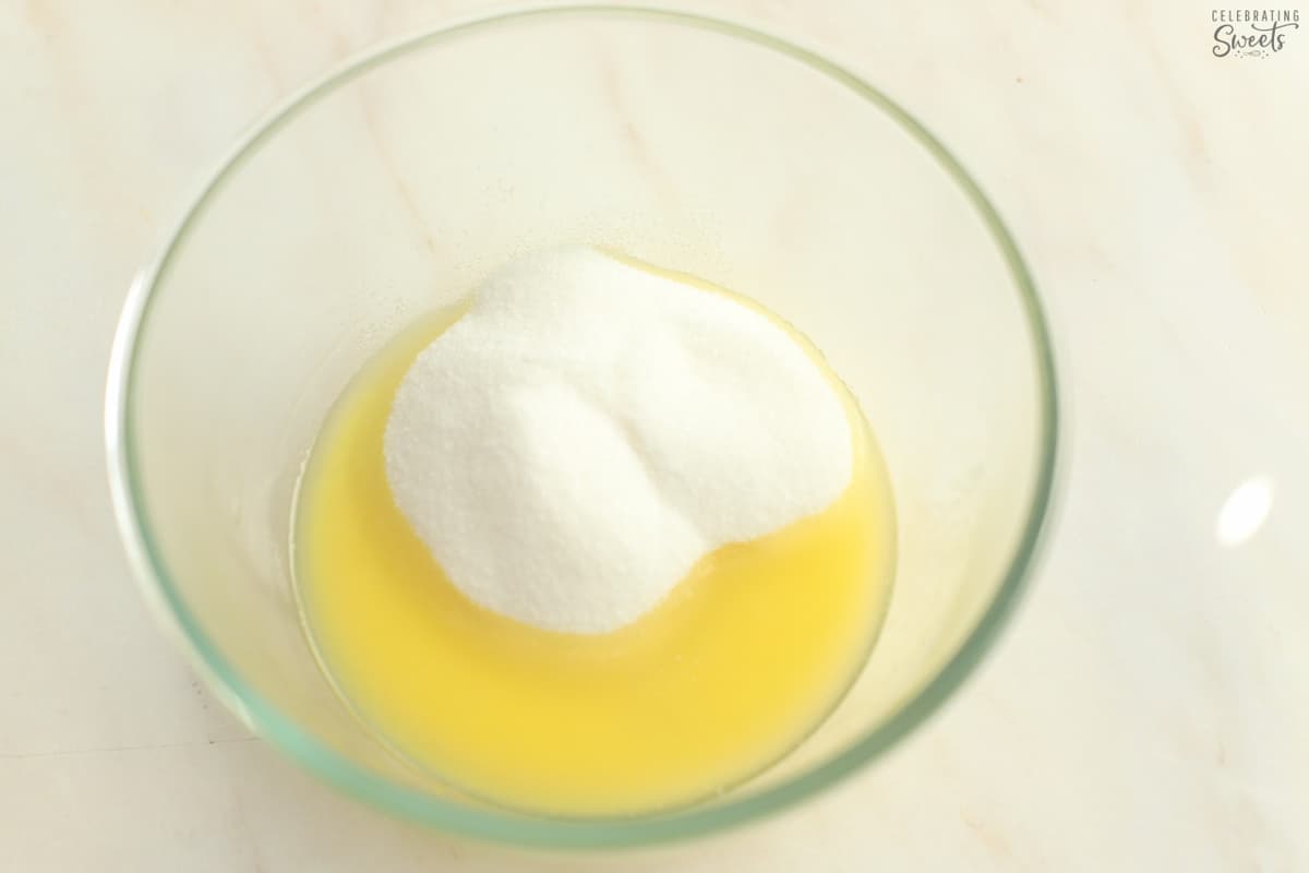 Melted butter and sugar in a glass bowl.