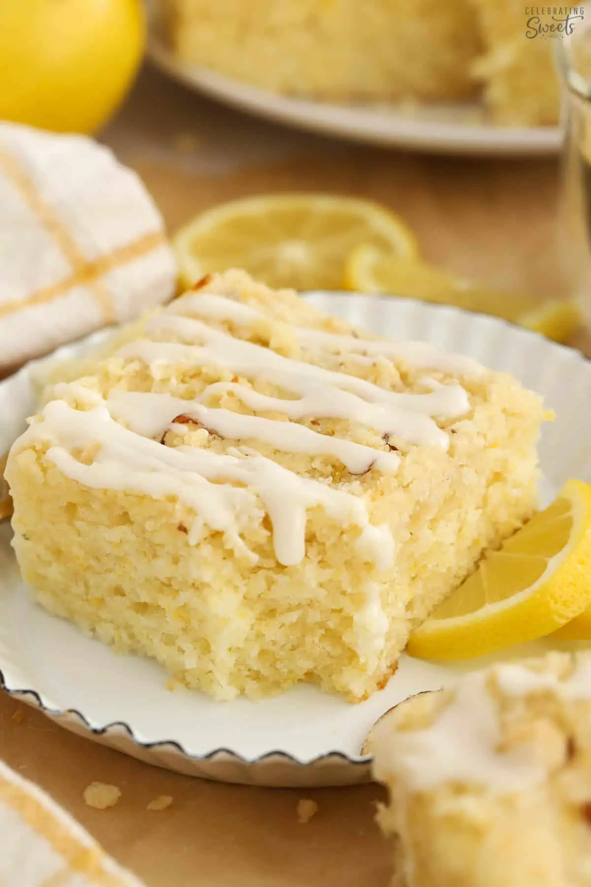 Slice of lemon crumb cake on a white plate.  Lemon Almond Coffee Cake with Streusel High Lemon Coffee Cake 5