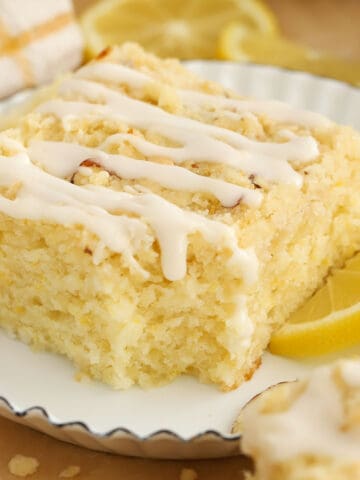 Slice of lemon crumb cake on a white plate.