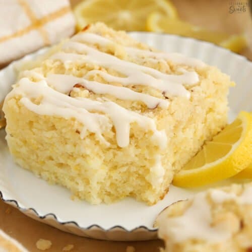 Slice of lemon crumb cake on a white plate.
