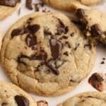 Chocolate chip cookies on parchment paper.
