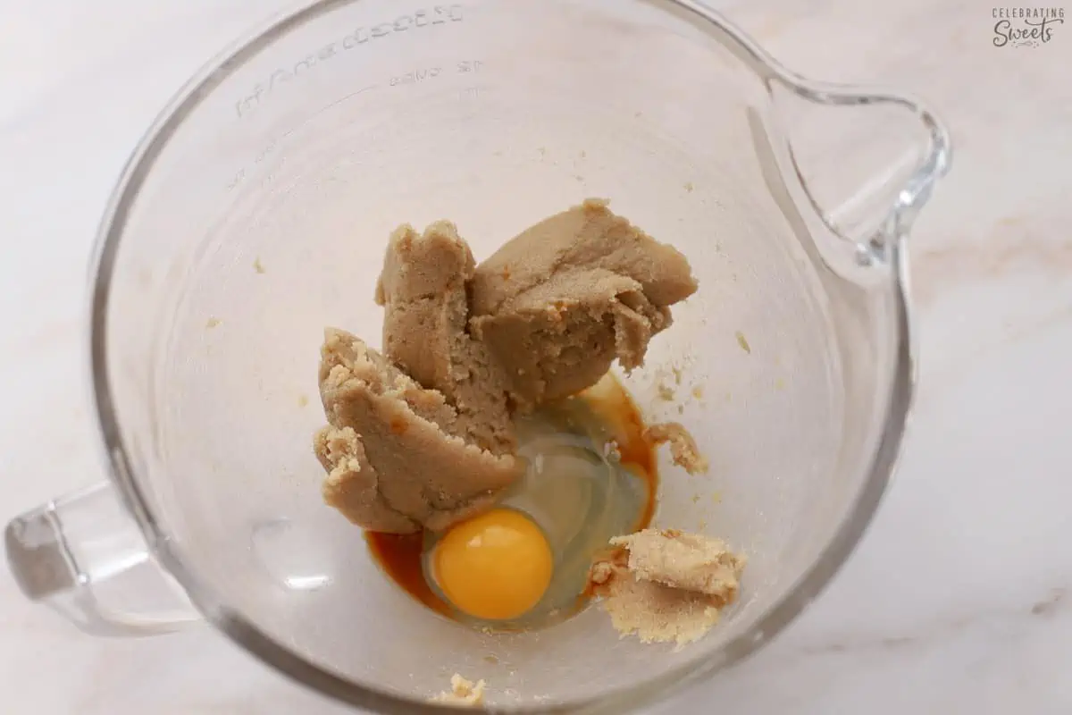 Egg, butter, sugar in a glass mixing bowl.