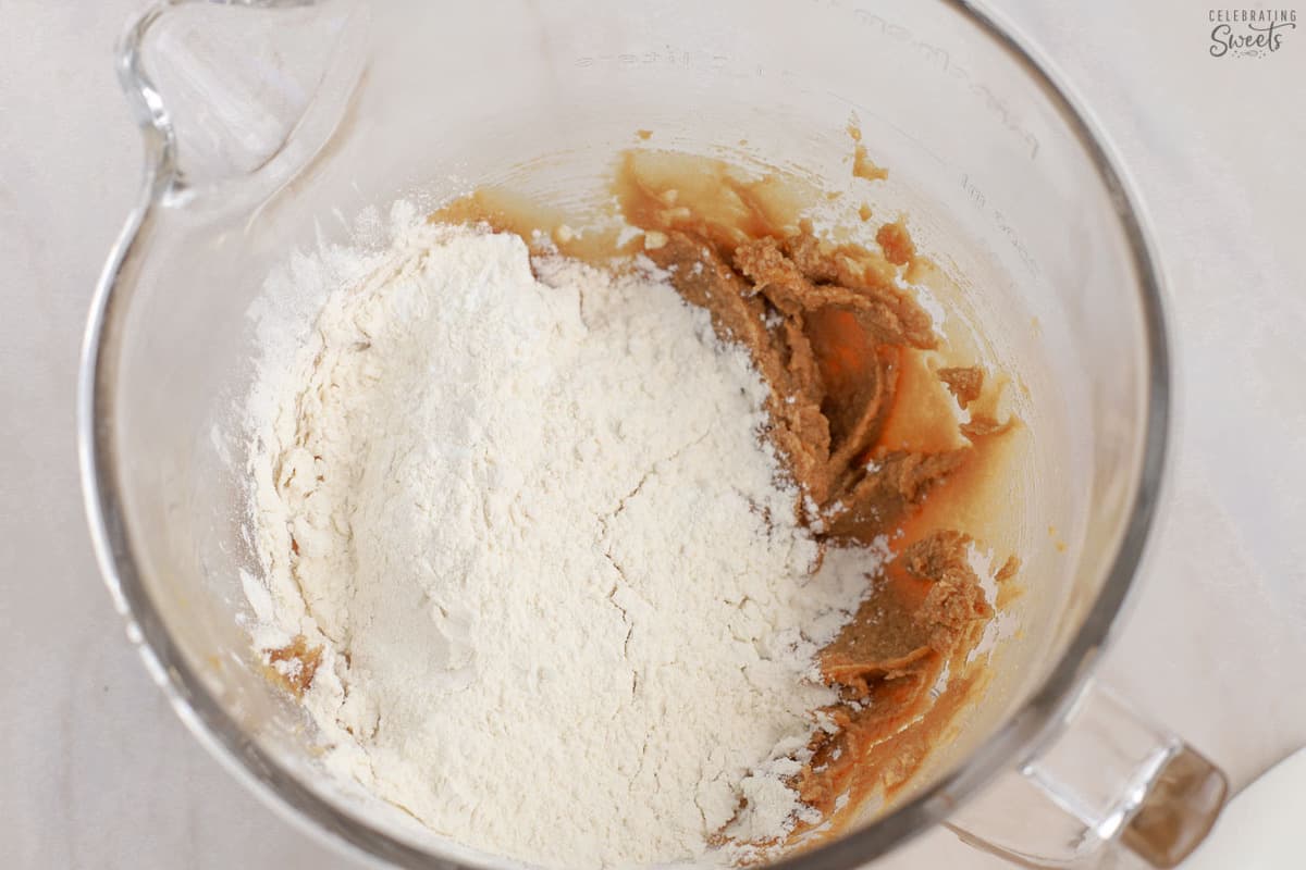 Flour, butter, sugar in a glass mixing bowl.