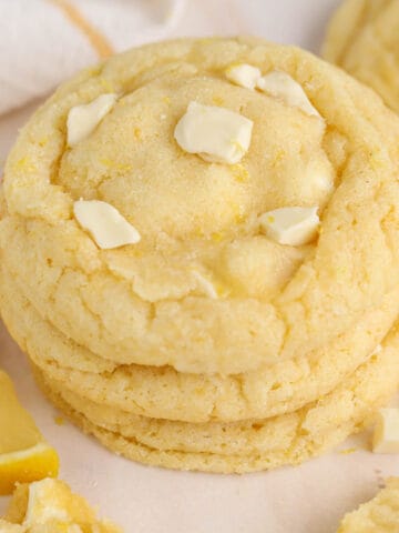 Stack of lemon cookies topped with white chocolate