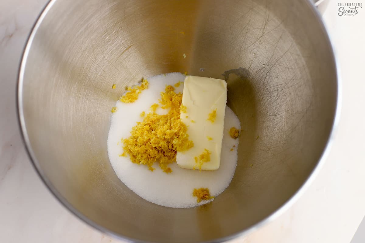 Butter, lemon zest, and sugar in a mixing bowl.