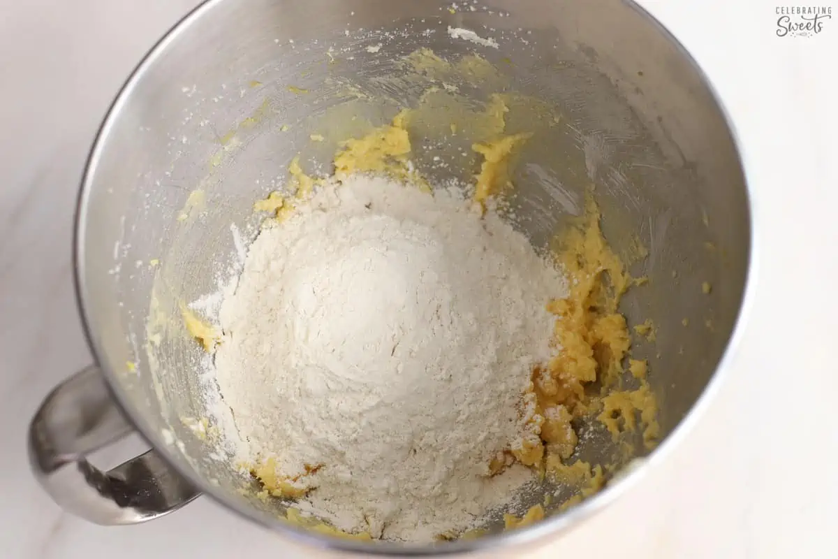 Flour, butter,, sugar in a mixing bowl.