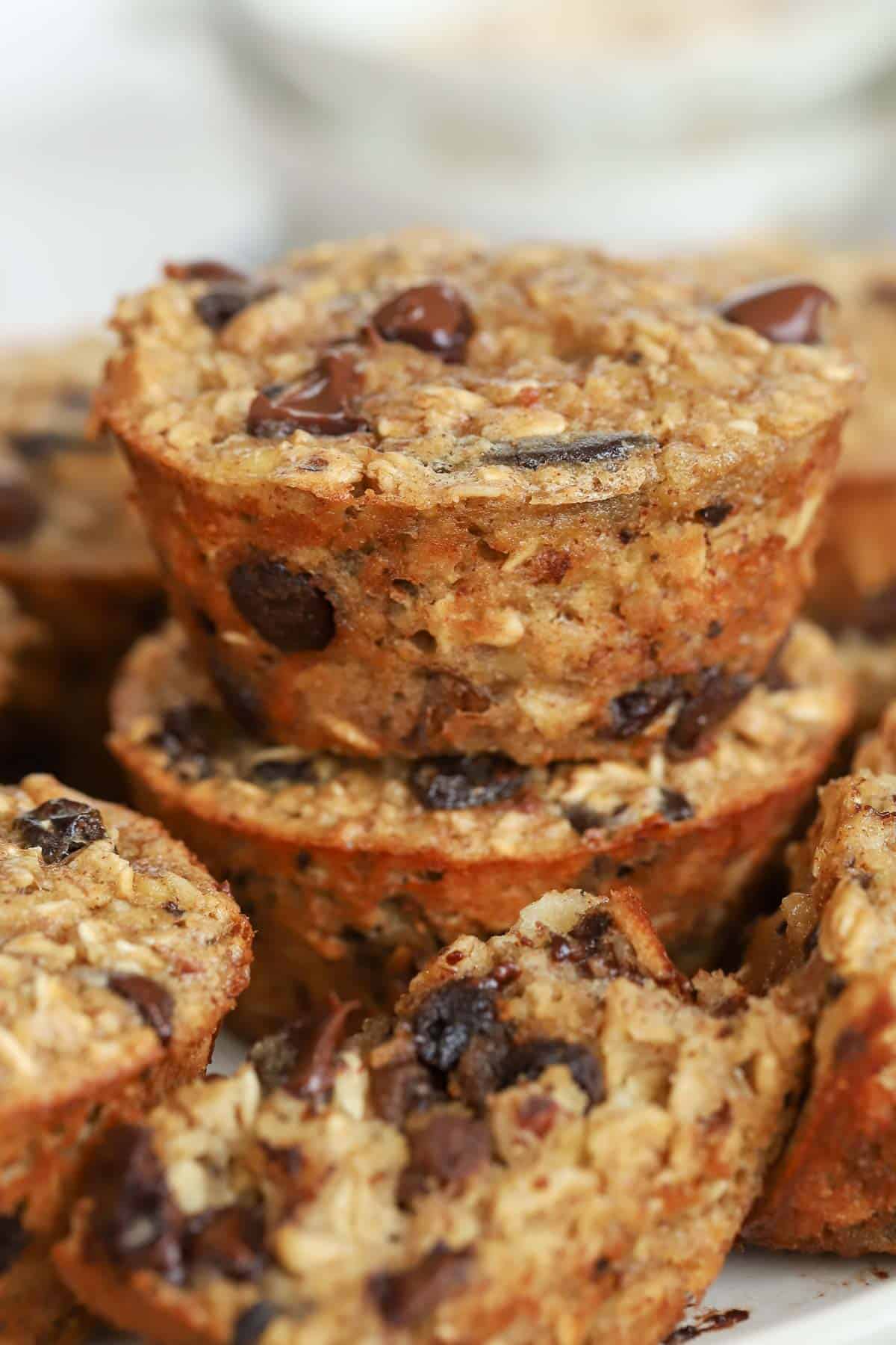 Stack of baked oatmeal cups with chocolate and raisins. 