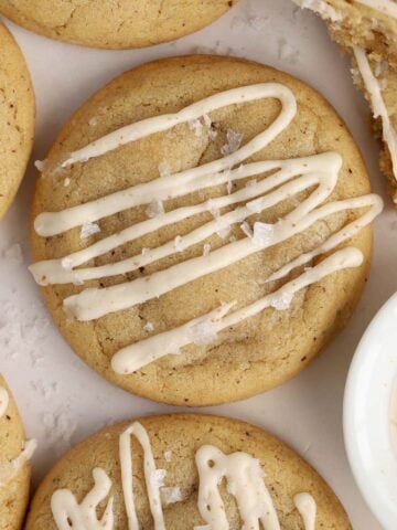 Closeup of brown butter cookie with a drizzle of icing.