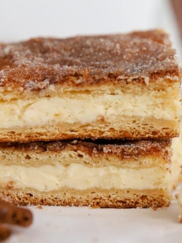 Stack of two pieces of churro cheesecake