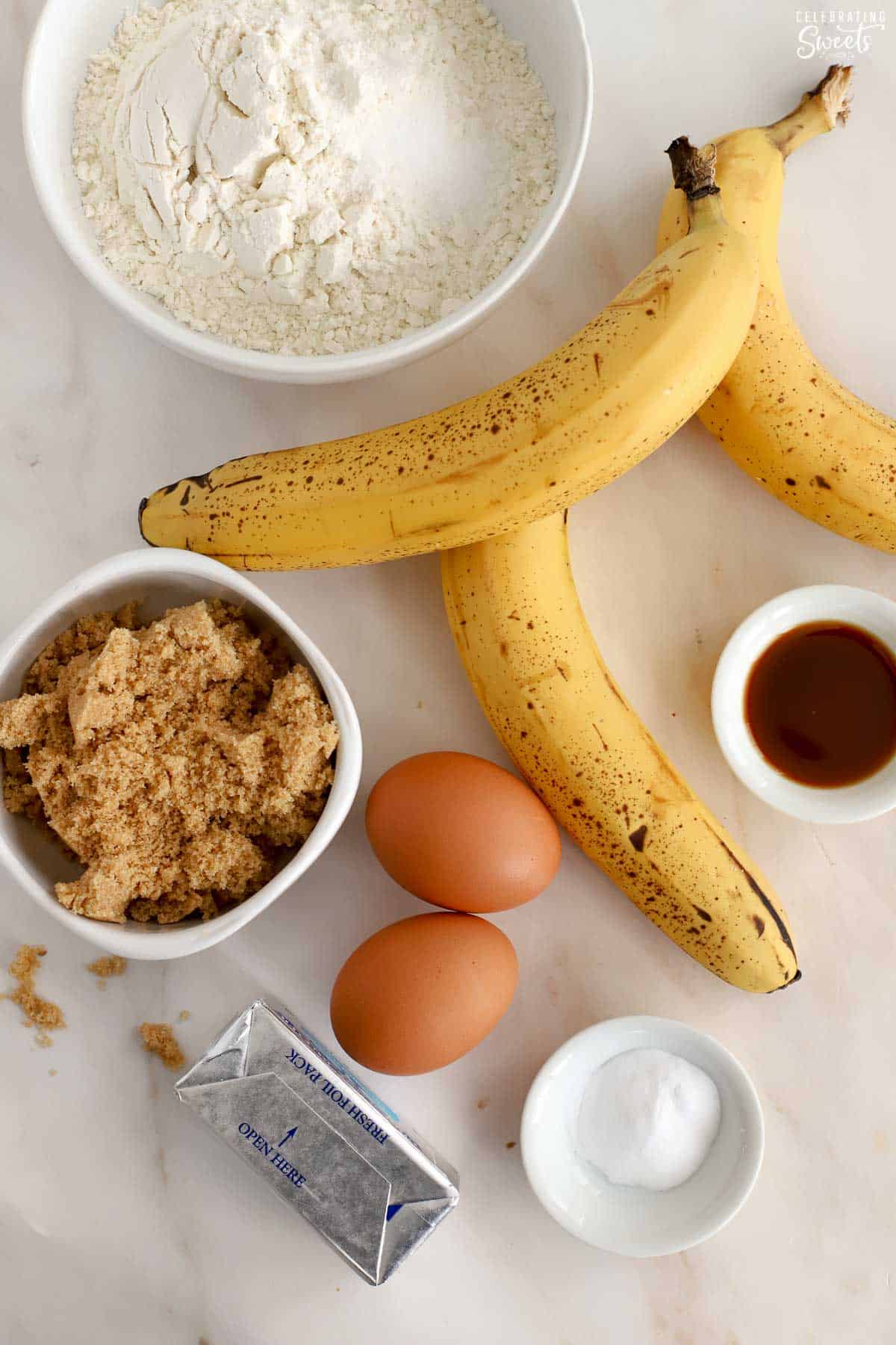 Easy Banana Bread ingredients: butter, sugar, flour, bananas, eggs baking soda.
