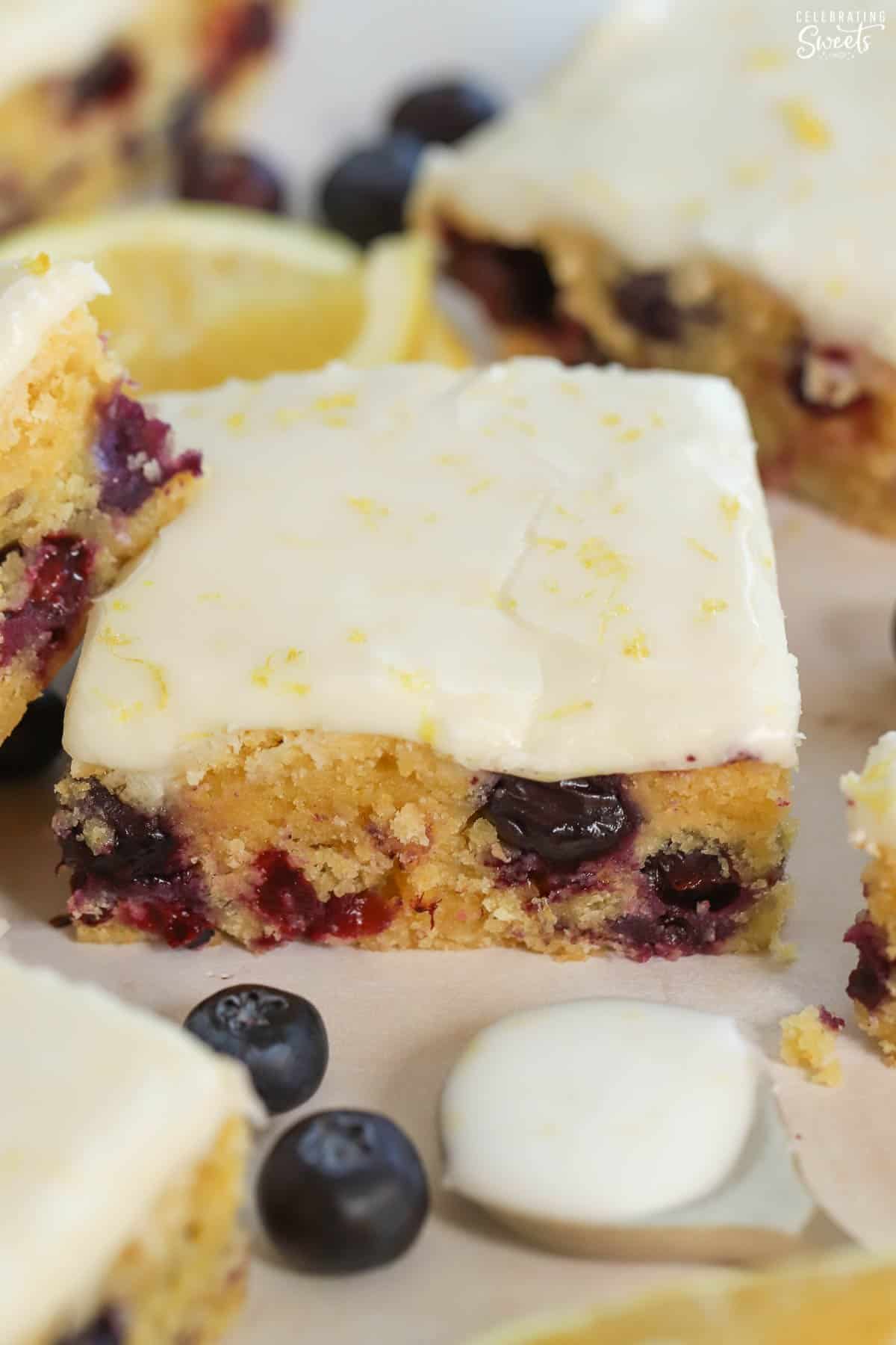 Lemon blueberry bar topped with white icing.