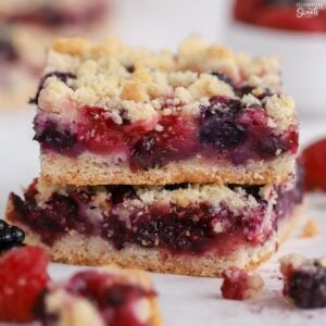 Stack of two berry crumble bars.