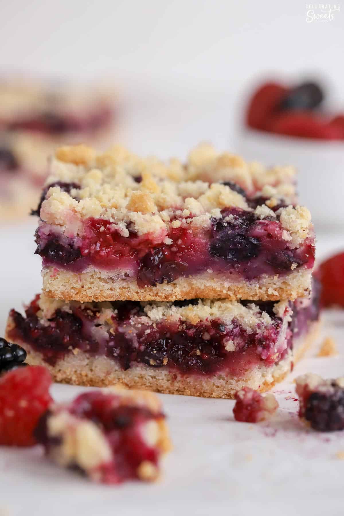 Stack of two berry crumble bars.