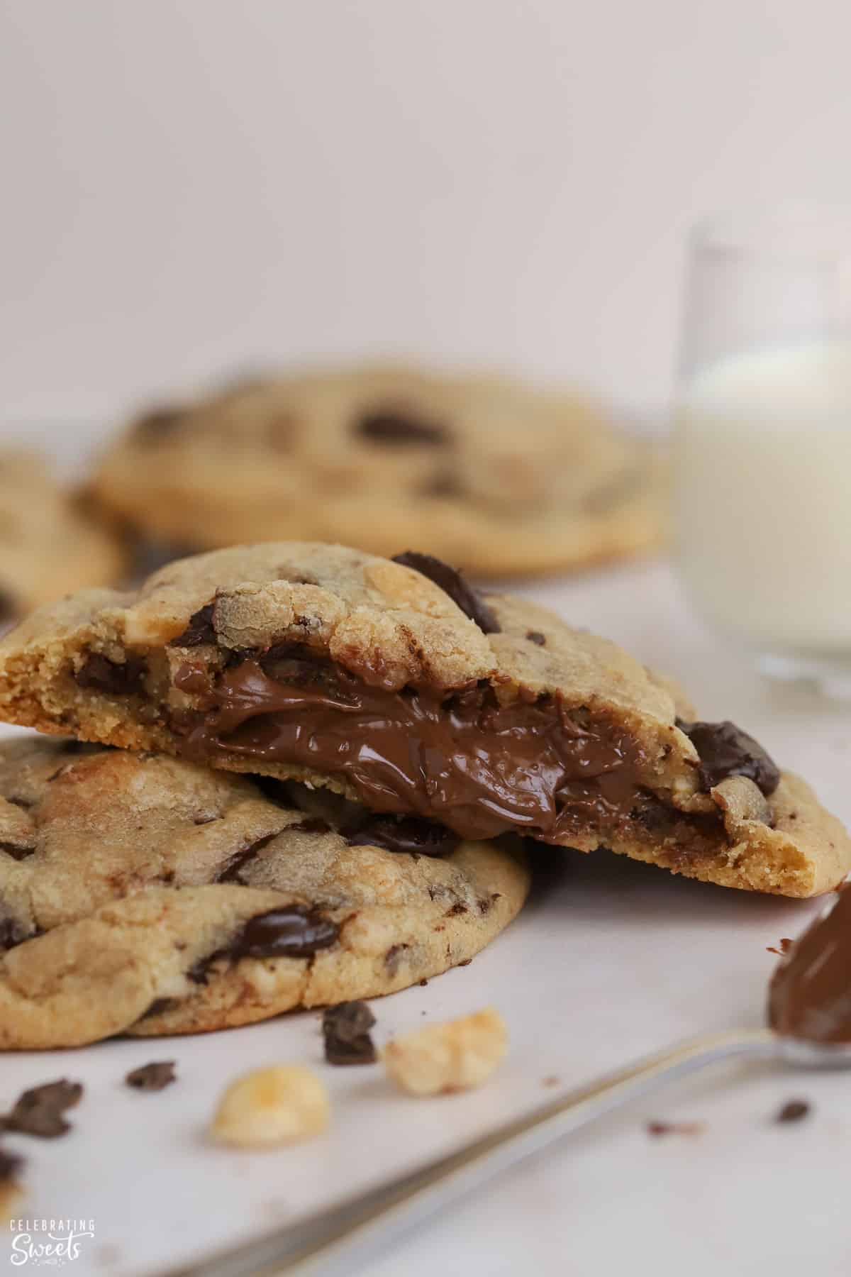 Cookie split open with Nutella filling inside.