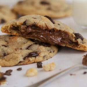 Cookie split open with Nutella filling inside.