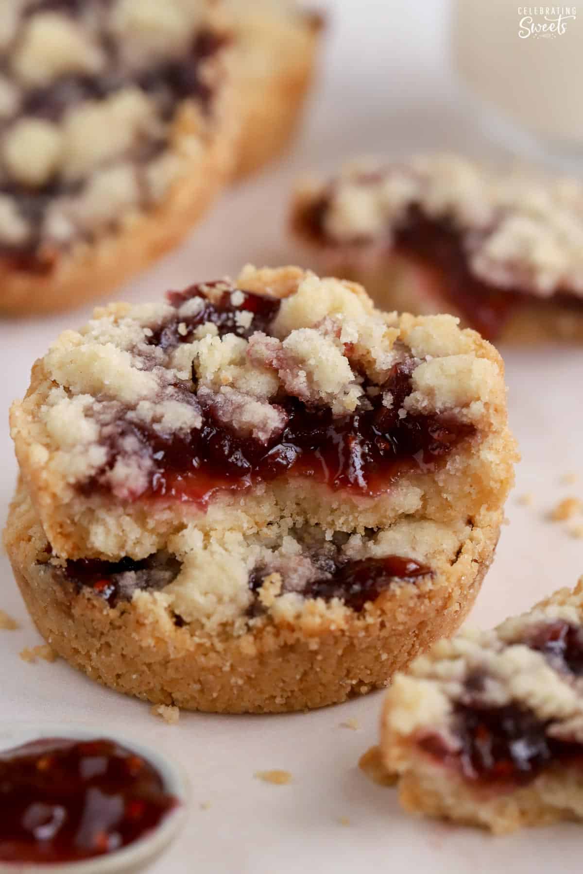 Stack of two raspberry crumble cookies.