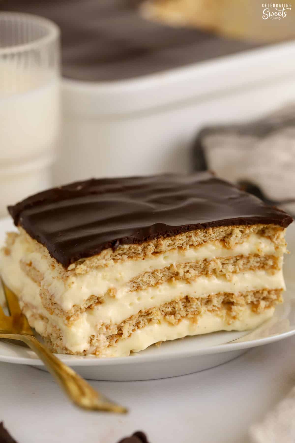Slice of eclair cake on a white plate.