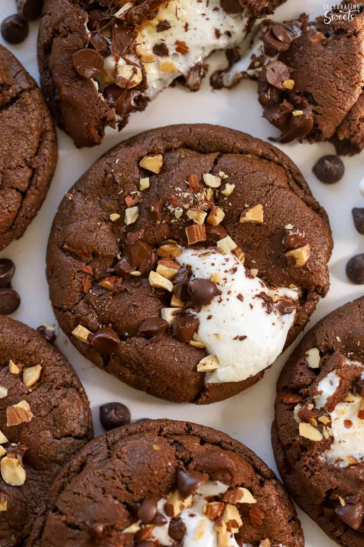 Chocolate cookie topped with marshmallows and nuts.