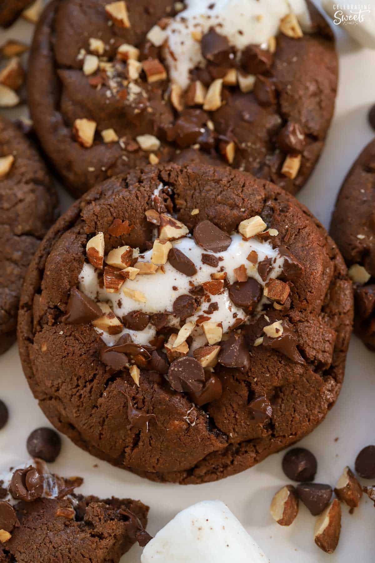 Chocolate cookie topped with marshmallows and nuts.