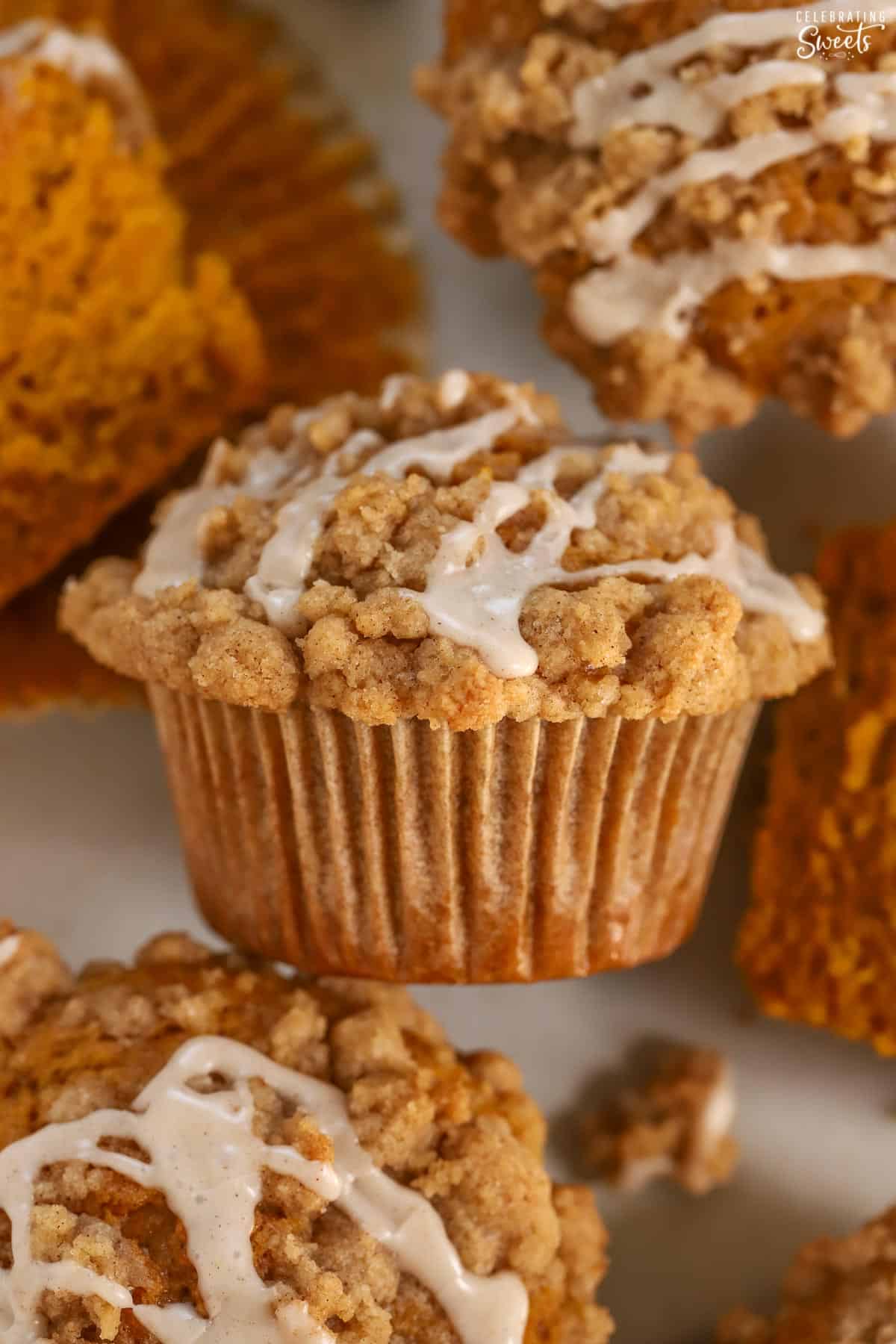 Closeup of a pumpkin muffin topped with icing.