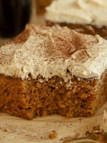 Slice of pumpkin spice latte cake next to a gold fork.