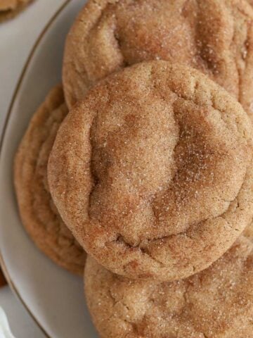 Maple snickerdoodle cookies on a grey plate.