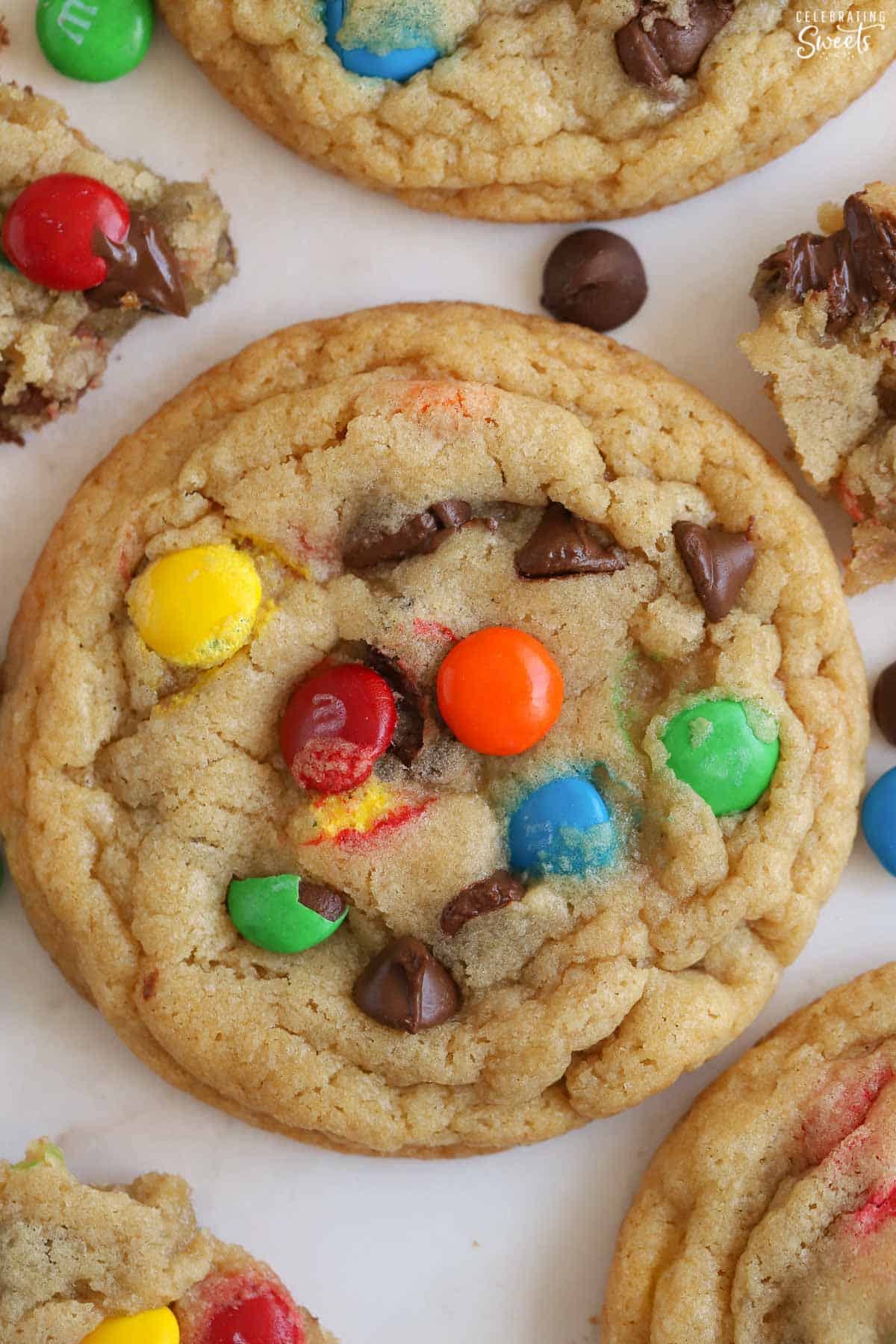 Closeup of an M&M cookie topped with chocolate chips and M&M's.