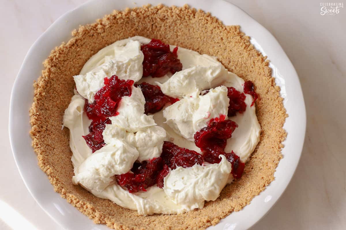 Cheesecake and cranberry sauce in a graham cracker crust.