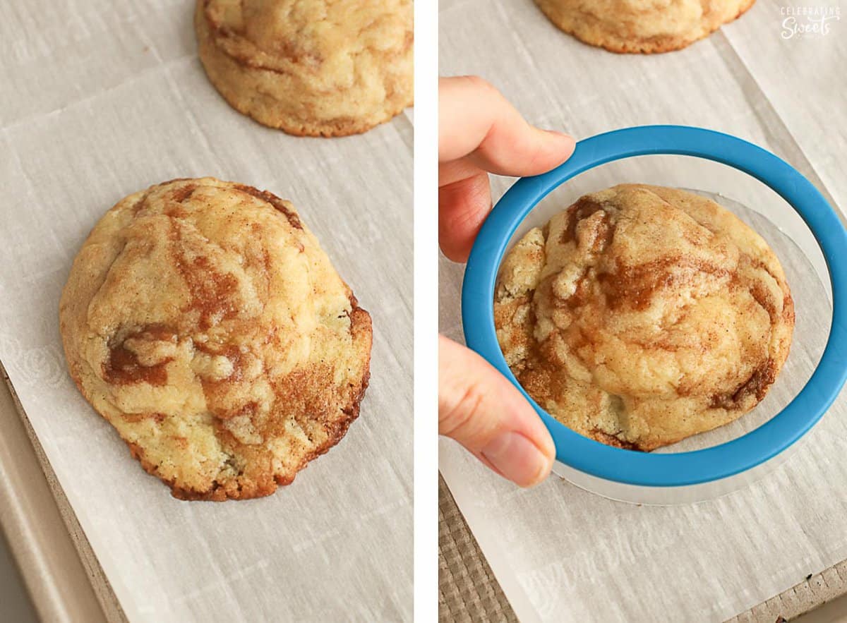 Cinnamon roll cookies on a baking sheet with a blue round cookie cutter.