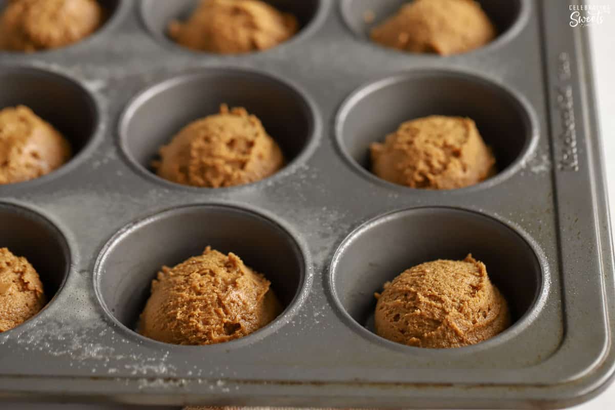Gingerbread cookie cup in a muffin pan.
