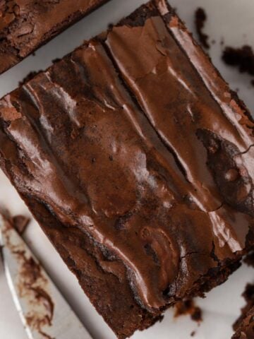 Closeup of a brownie next to a knife