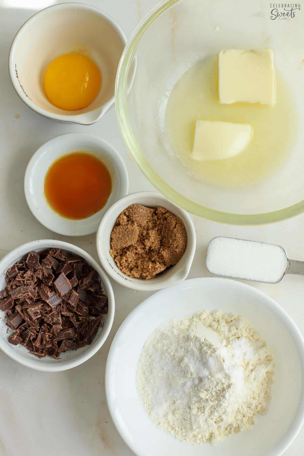 Ingredients for a single serve cookie: butter, egg yolk, sugars, flour, chocolate, vanilla.