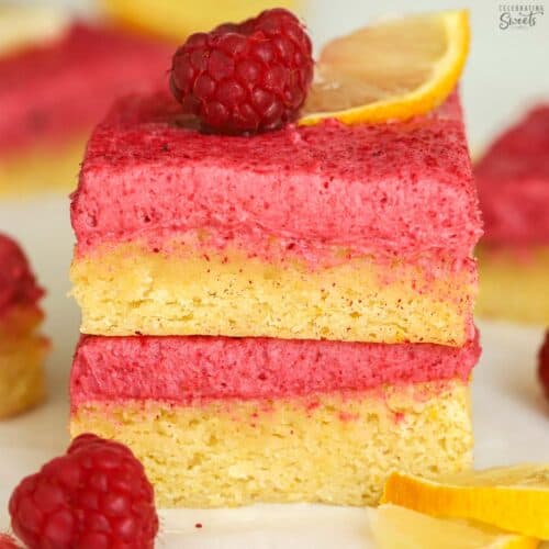 Two raspberry lemon bars stacked on top of each other.