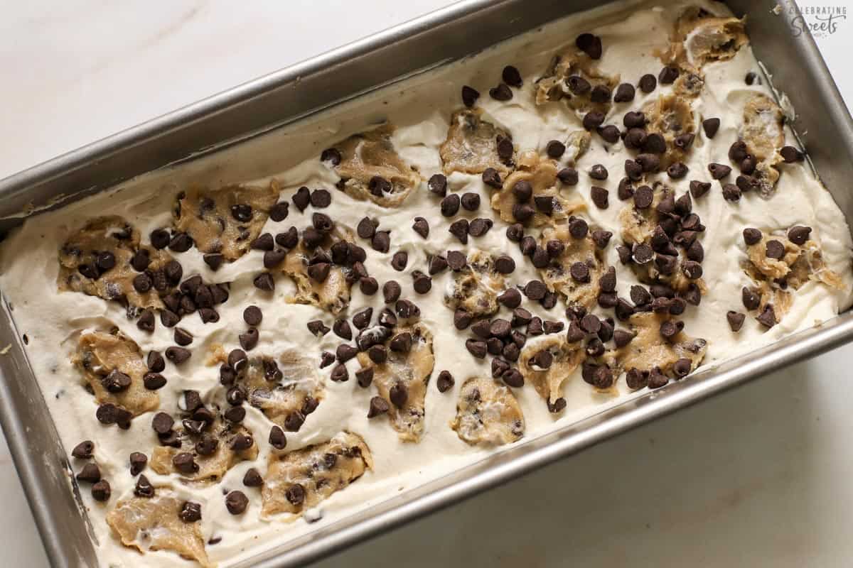 Cookie dough ice cream in a metal loaf pan.
