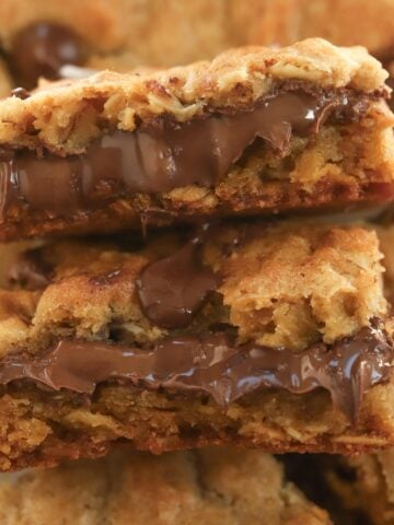 Two pieces of nutella cookie bars stacked on top of each other.